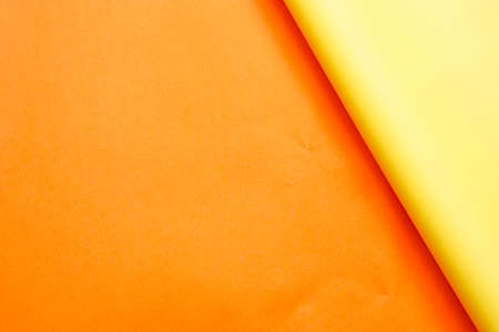 Yellow paper and orange paper for background.の写真素材