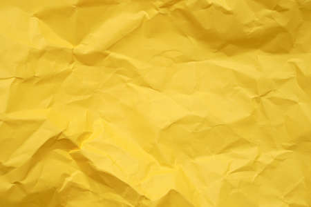 blank crumpled yellow paper for background.の写真素材
