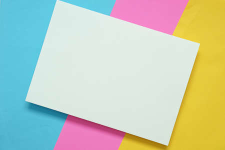 top view of blank  white A4 paper on colorful paper with copy space, conceptual design of mock up brochure for summer seasonの写真素材