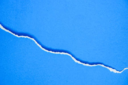 abstract background with ripped blue paper and shadow for background.の写真素材