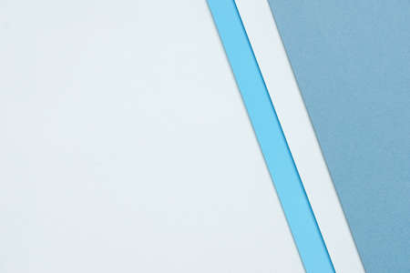 abstract background concept with a geometric pattern in various hues of blue paper stacking on white...