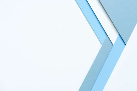 abstract background concept with a geometric pattern in various hues of blue paper stacking on white backgroundの写真素材