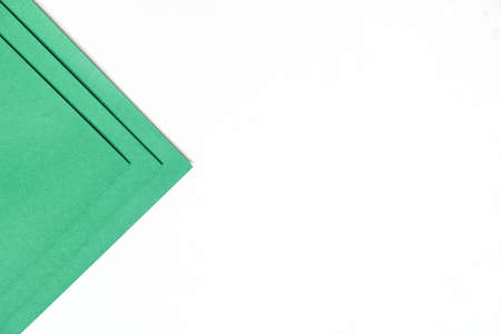On a blank white background with soft shadow and copy space, dark green paper is layered in geometric forms., abstract background concept.の写真素材