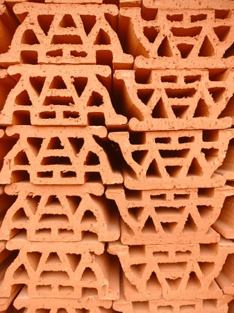 patterned abstract background, made of piles of stone building materials made of red clayの写真素材