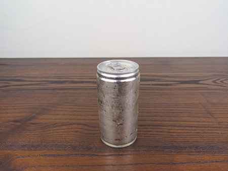 close up cans of cold energy drinks on a wooden table