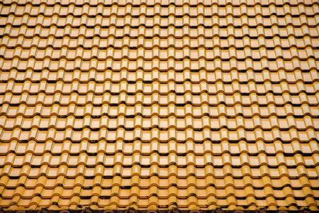 pattern of yellow ceramic roof tilesの写真素材