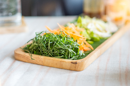 Vegetables of Rice salad set on wood plate, Khao yam, Thai cuisineの写真素材