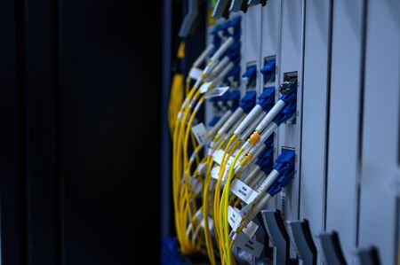 Network switch front panel with fiber optics patch cord connected