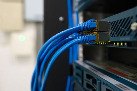Network device front panel with utp cables connected in data center room