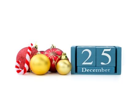 25th December of wood calendar with xmas ornament on white backgroundの写真素材