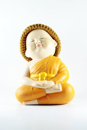 Buddhist novice doll pottery monk on white backgroundの写真素材