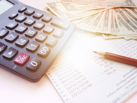 Business, finance, savings, banking or car loan concept : Pencil, calculator, money and savings...