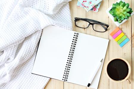 Business, weekend, holiday or good morning concept : Flat lay or top view of white knitted blanket,...