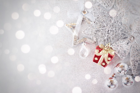 Happy New Year, Merry Christmas, celebration or holiday background concept : Red and shiny silver ornaments on bright background, Top view or flat lay with copy spaceの写真素材
