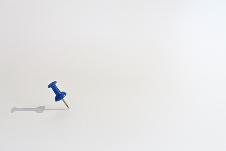 Business vision, mission, target or goal concept : Blue thumbtack on white background with copy space ready for adding or mock upの写真素材