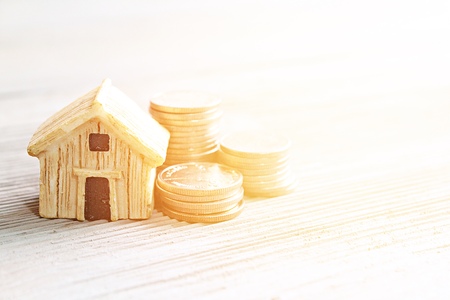 Business, finance, saving money, property ladder or mortgage loan concept : House model and coins on...