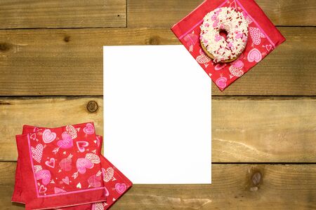 Valentines Day Mockup with a donut and holiday napkins on woodの写真素材