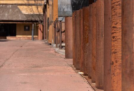 Rusted columns down a pathの写真素材