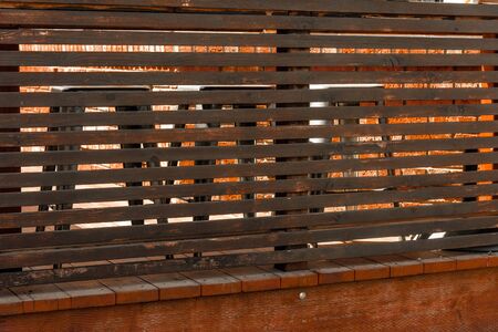 bar stools behind slatted wood textureの写真素材