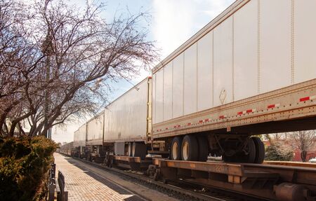 Blank train car passing by. Great for mocking up logos and advertising.の写真素材