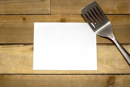 BBQ Spatula with horizontal blank 8.5x11 paper on rustic weathered wood backgroundの写真素材