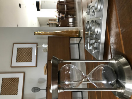 Close-up of an hourglass in the interior of a modern room