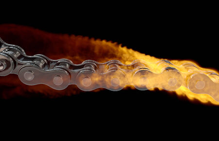 computer generated illustration one motorcycle chain  in flame on black backgroundの写真素材