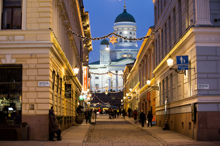 HELSINKI, FINLAND - DECEMBER 17, 2017: Festive street with Christmas decorations overlooking the Cathedral on the Senate square.  A lot of people and bright decorations.のeditorial素材