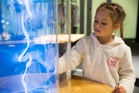 Helsinki, Finland - June 10, 2019: Finnish science center Heureka in Vantaa. Child studying electrical discharges in a lab.のeditorial素材
