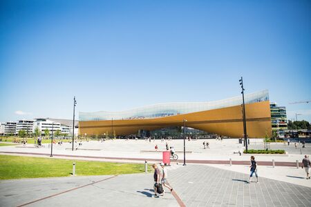 Helsinki, Finland- July 25 2019: New Helsinki central library Oodi exterior. Modern northern architecture. Entrance of the building on city square, sunny summer day.のeditorial素材
