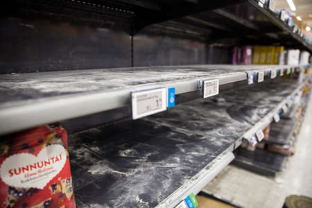 Espoo, Finland - 13 of march 2020: Empty shelves of supermarkets in Espoo, Finland. People stockpiling during Coronavirus pandemicのeditorial素材