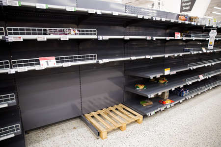 Espoo, Finland - 13 of march 2020: Empty shelves of supermarkets in Espoo, Finland. People...