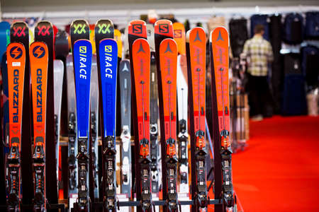 HELSINKI, FINLAND - NOVEMBER 15, 2019: Ski shop sale. Rows of colourful skis in sport equipment storeのeditorial素材