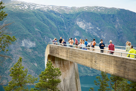 Aurland, Norway - Jun 20, 2023: Tourists on Stegastein viewpoint observation deck 650 metres above Aurlandsfjord.のeditorial素材