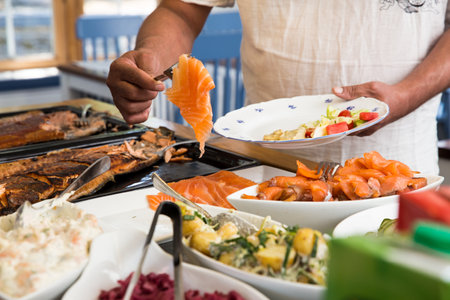 Variety dishes served buffet dinner. Mediterranean ketogenic diet, fish and vegetables. Healthy dinner restaurant buffet menuの写真素材