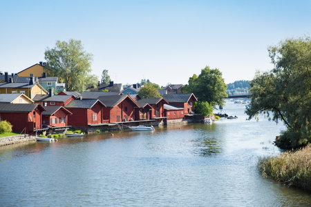 Porvoo, Finland - September 2: Townscape of Old town of Porvoo. Picturesque wooden houses on a river slope. Stone Medieval Lutheran cathedral on a hill. Warm sunny summer day.のeditorial素材