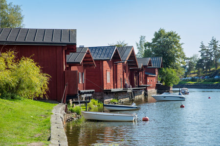 Porvoo, Finland - September 2: Townscape of Old town of Porvoo. Picturesque wooden houses on a river slope. Stone Medieval Lutheran cathedral on a hill. Warm sunny summer day.の写真素材