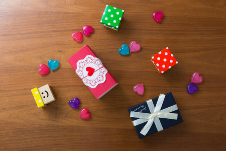 multi-colored gift boxes on a wooden tableの写真素材