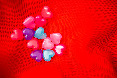 colorful heart shapes on red background