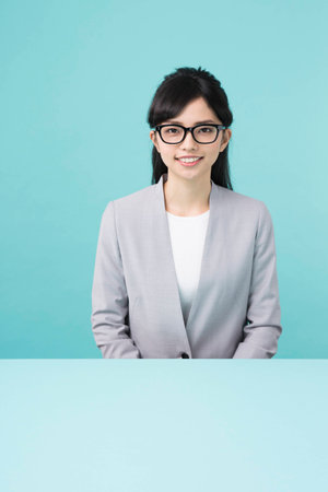 A woman with black rim glasses smilingの写真素材