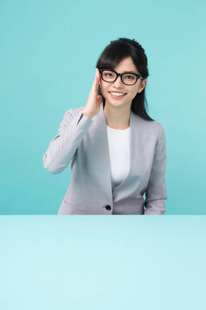 A woman with black rim glasses smilingの写真素材