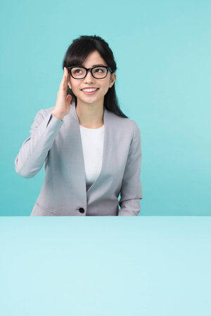 A woman with black rim glasses smilingの写真素材
