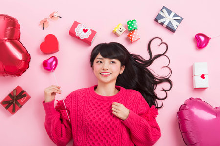 A woman surrounded by giftsの写真素材