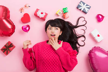 A woman surrounded by giftsの写真素材