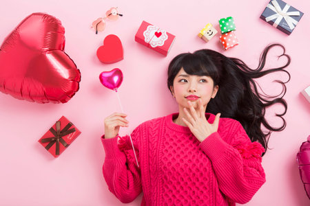 A woman surrounded by giftsの写真素材