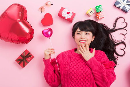 A woman surrounded by giftsの写真素材
