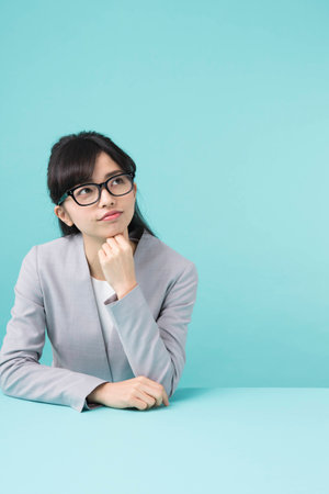 A woman smiling at a deskの写真素材