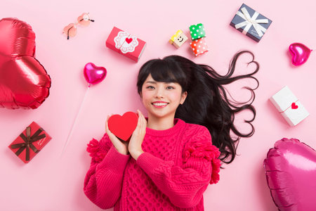 A woman surrounded by giftsの写真素材