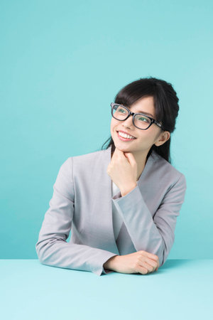 A woman smiling at a deskの写真素材