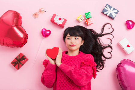 A woman surrounded by giftsの写真素材